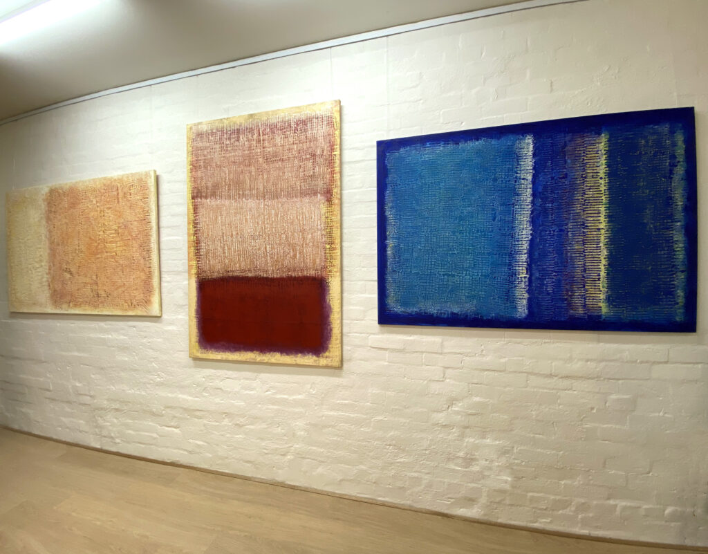 Paintings on display in Malcolm Koch's art gallery.